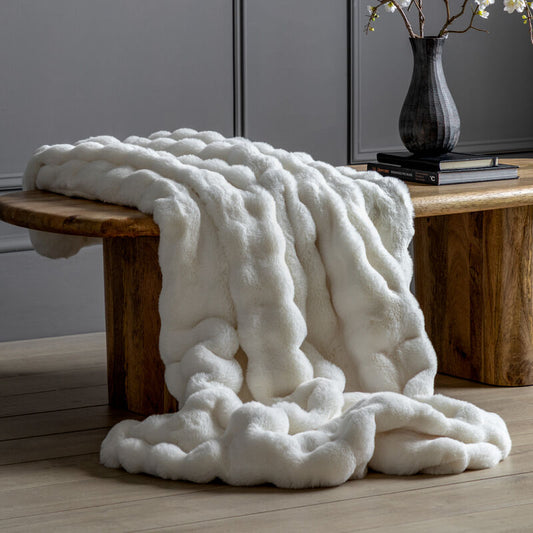 marshmallow faux rabbit throw in cream