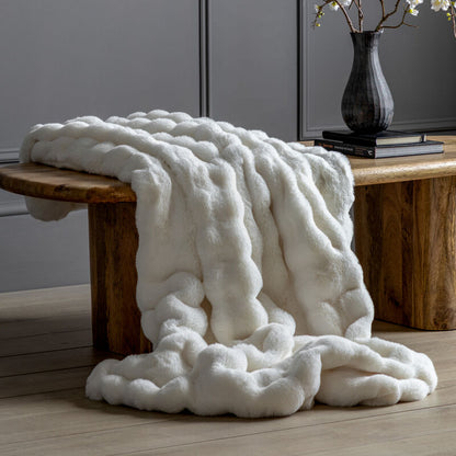 marshmallow faux rabbit throw in cream