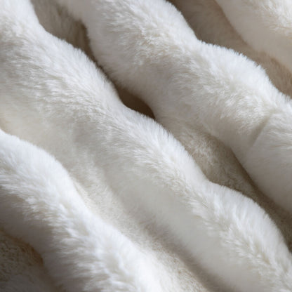 marshmallow faux rabbit throw in cream