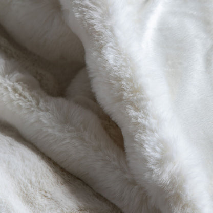 marshmallow faux rabbit throw in cream