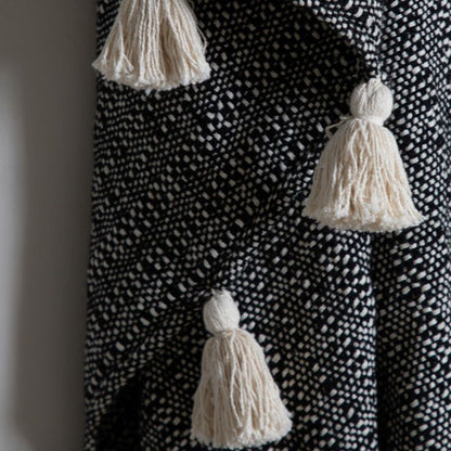 tish tassel throw in black - nineteen/seventy